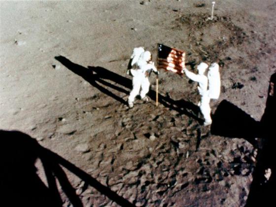 Neil Armstrong and Buzz Aldrin Plant US Flag on the Moon