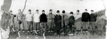 Group portrait of the Columbus Panhandles Football Team, identified from left to right as: John Nesser, Frank Nesser, Reagan Burton, Andy Kertzinger, Chief Henry, Ed Hughes, Joe Carr (founder and manager), Harry Greenwood, Phil Nesser, Fred Nesser, Baker, and Carlise. The Panhandles were one of the first professional football teams to join the American Professional Football Association, renamed the National Football League, when it formed in 1920. They operated as a professional football franchise from 1920-1922, then again from 1923-1926. Note: Complete name identification and date provided by Chris Willis, former OHS employee now with NFL Films.