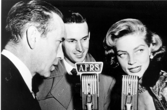 Jack Brown interviews Humphrey Bogart and Lauren Bacall for broadcast to troops overseas during World War II.