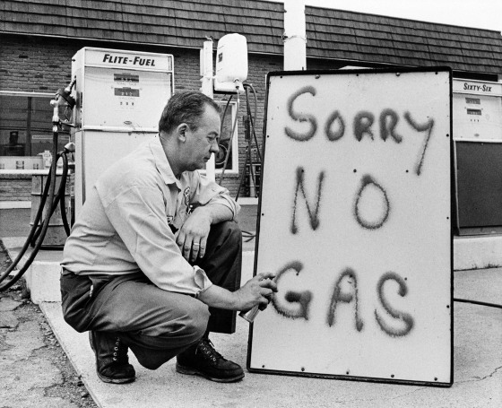 Leon Mill spray-paints a sign outside his Phillips 66 station in Perkasie, Pa., in 1973 to let his customers know he's out of gas. An oil crisis was the culprit, squeezing U.S. businesses and consumers who were forced to line up for hours at gas stations.